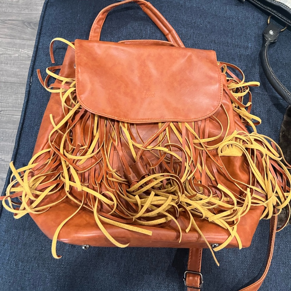 Caramel fringe leather backpack